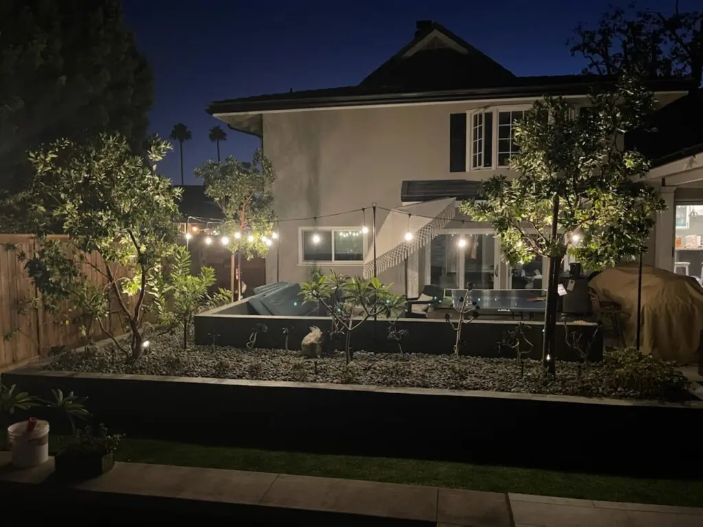 Backyard hardscape with string lights
