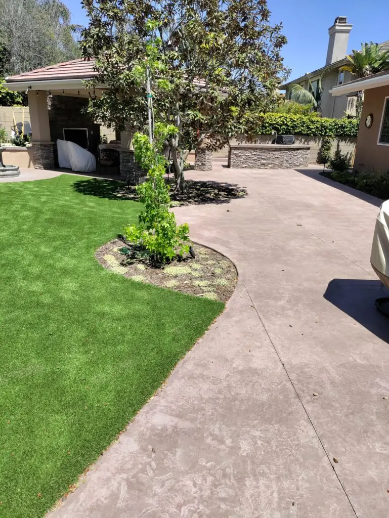 Backyard patio with artificial turf